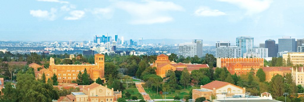 Skyline of Los Angeles behind an aerial shot of UCLA campus.